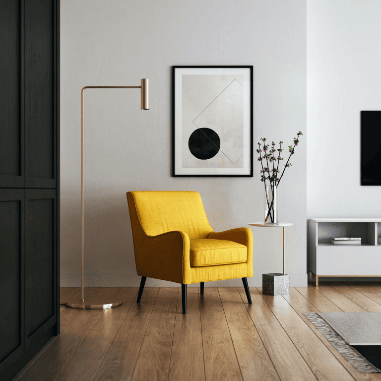Modern furniture setting with focus on a yellow chair and golden lamp